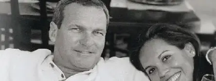 A black-and-white photograph of Mike and Margot Murphy together, both smiling