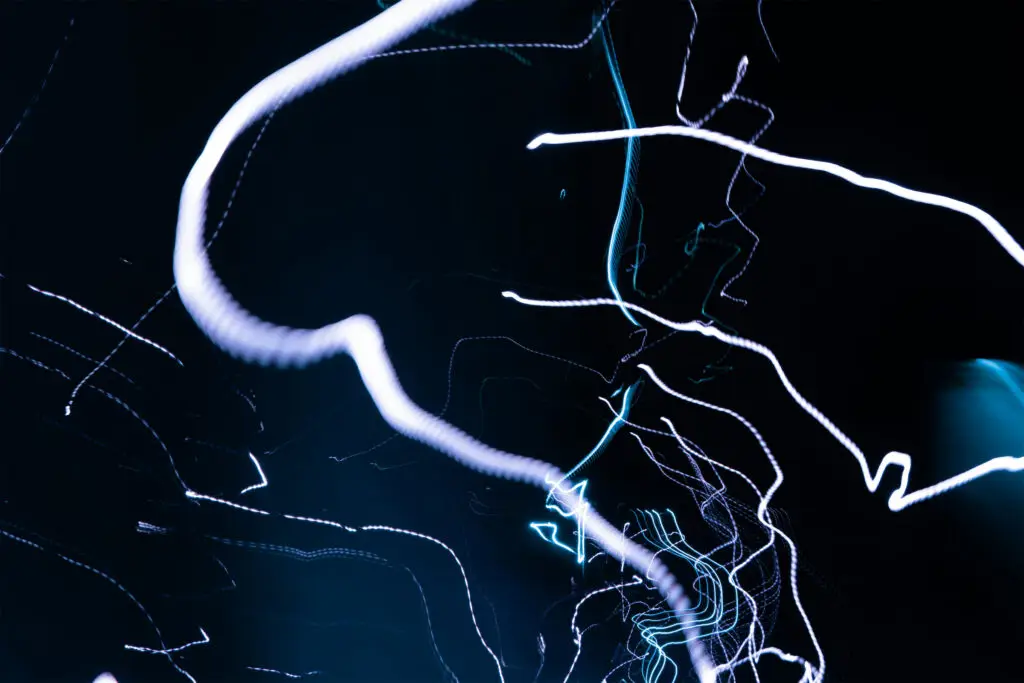 An illustrative rendering of neural pathways, representing brain mapping and neurofeedback