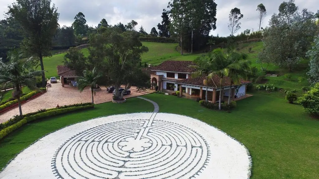 The labyrinth from the air, with the house and trees behind